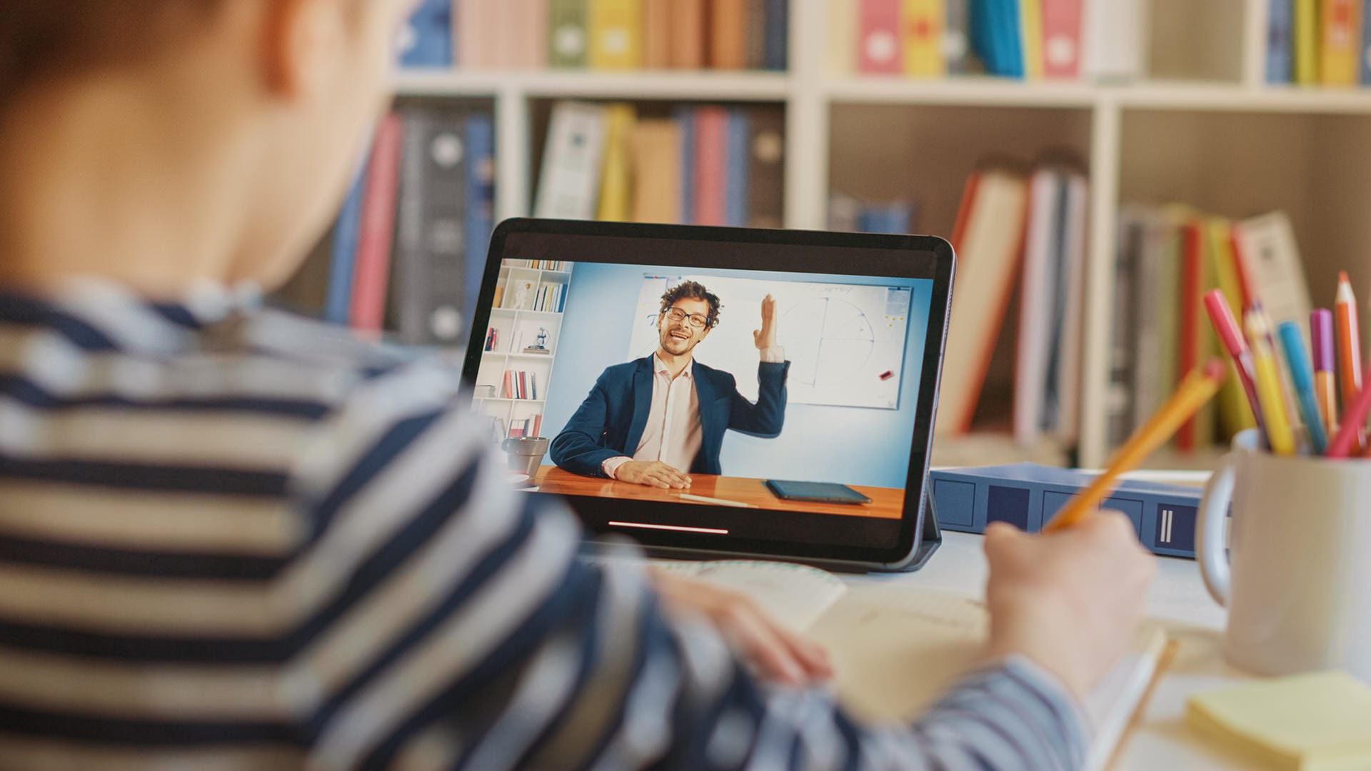 Smart Little Boy Uses Digital Tablet for Video Call with His Tea